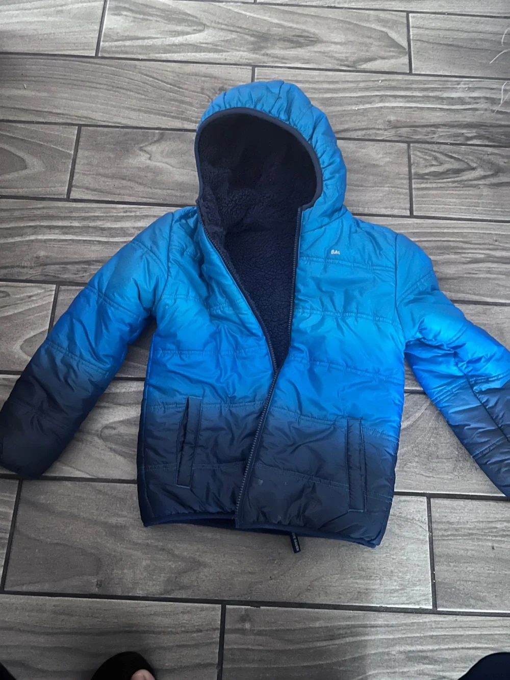 Children's jacket for cold waterproof and plush inside